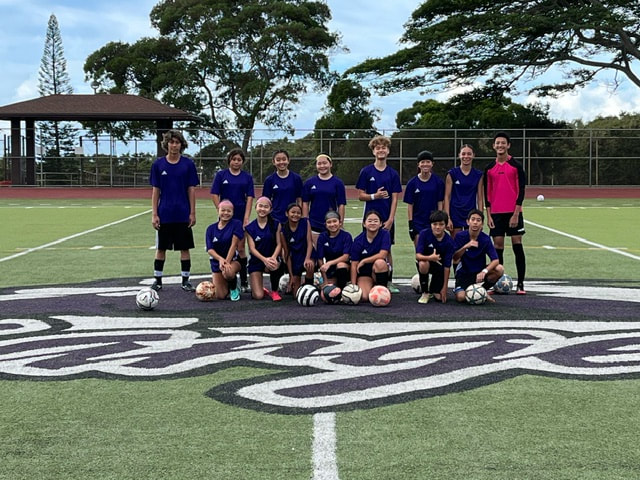 Highlands Intermediate Soccer Team posing with Aiea Intermediate Soccer Team. 