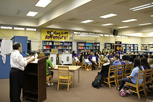 Students sitting inside of the library.